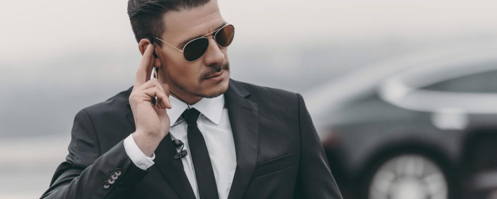 handsome-bodyguard-listening-message-with-security-2021-08-29-18-18-52-utc