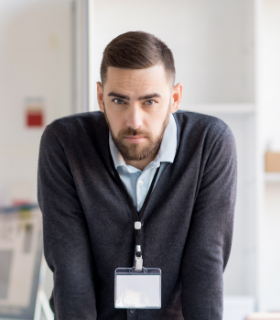 serious-office-worker-looking-at-camera-86QF37A