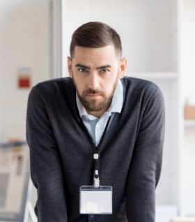 serious-office-worker-looking-at-camera-86QF37A