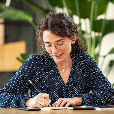 woman-writing-down-notes-on-agenda-2021-08-29-23-41-24-utc
