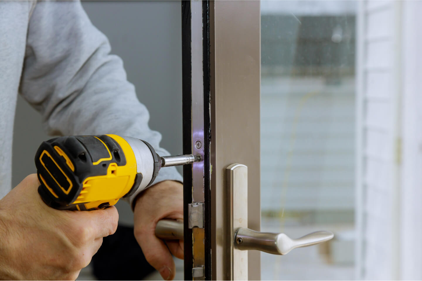 locksmith-in-installing-new-house-door-lock-hand-h-2021-08-29-01-07-52-utc