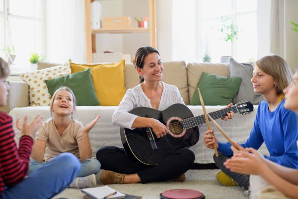 group-of-homeschooling-children-with-teacher-havin-2021-08-31-14-38-39-utc