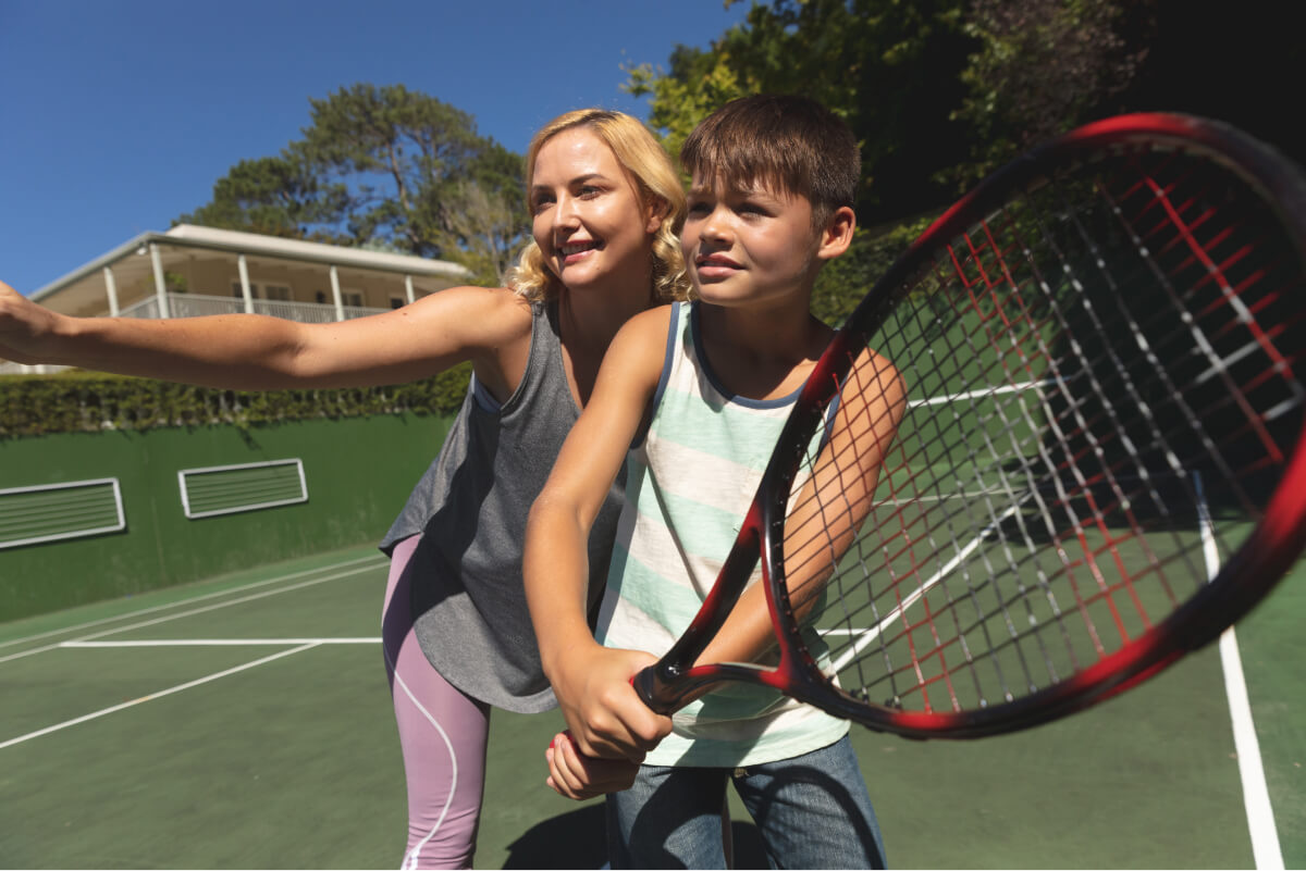 caucasian-mother-and-son-outdoors-playing-tennis-2022-02-07-22-22-35-utc