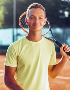 young-man-teenager-with-tennis-racket-standing-nea-2021-09-03-05-42-00-utc
