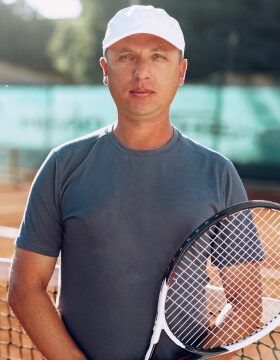 middle-aged-man-tennis-player-with-racket-standing-2021-09-03-12-46-25-utc