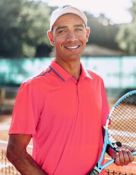 middle-aged-man-tennis-player-with-racket-standing-2021-09-03-17-21-09-utc
