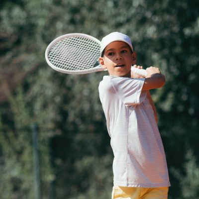 tennis-instructor-with-boy-in-tennis-lesson-2021-08-26-16-54-04-utc