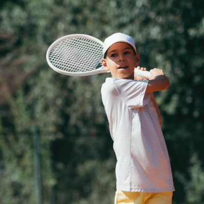 tennis-instructor-with-boy-in-tennis-lesson-2021-08-26-16-54-04-utc