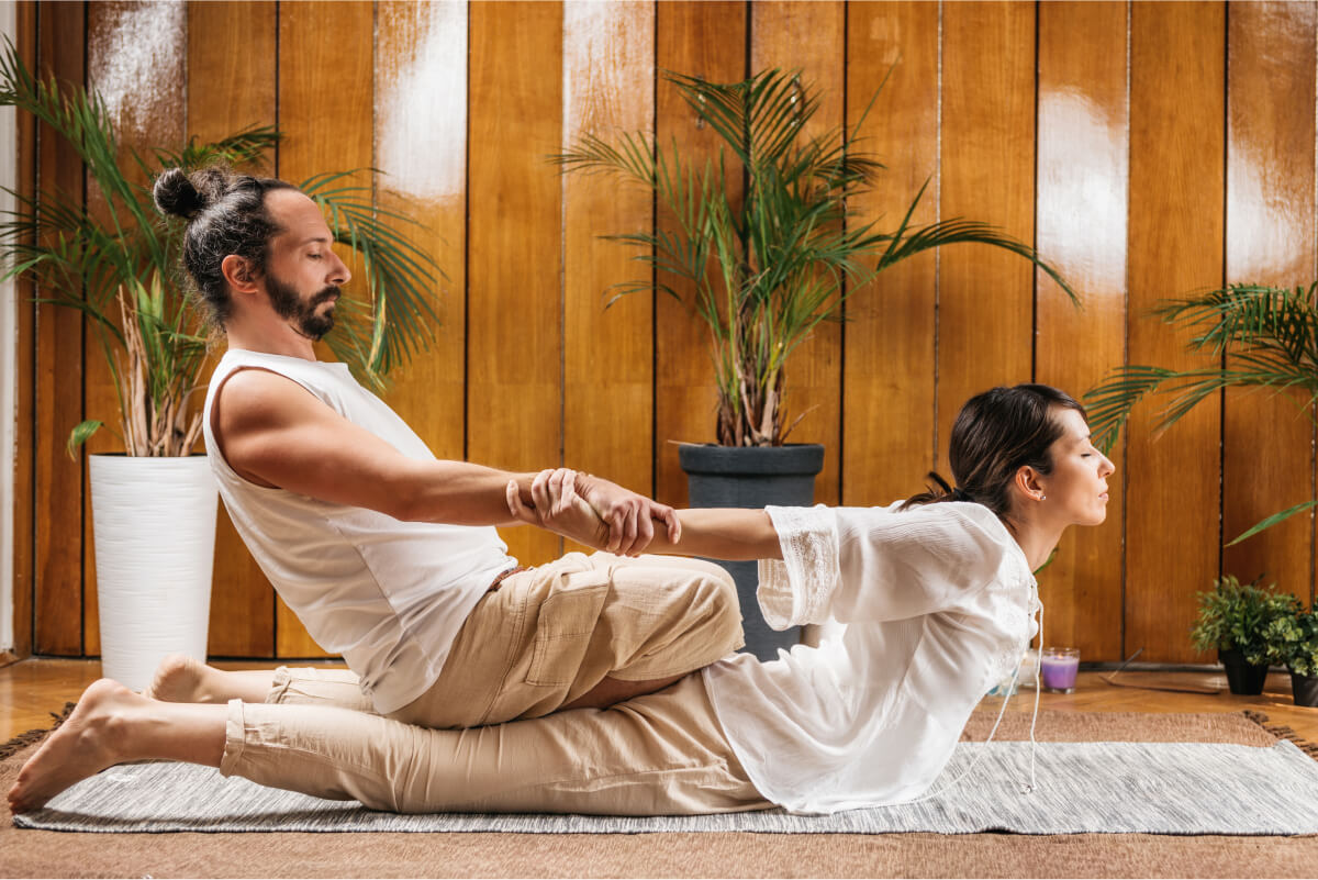thai-yoga-massage-stretching-female-patient-in-t-2021-09-02-16-33-09-utc